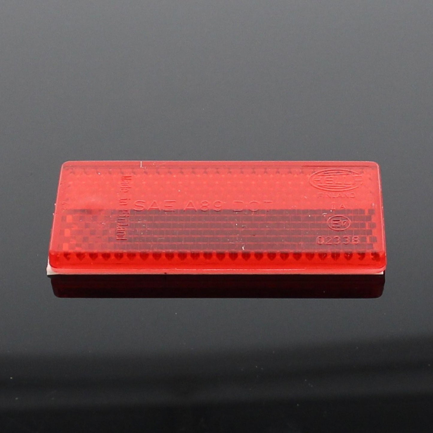 Hella Rückstrahler Rot selbstklebend 70x31x5mm