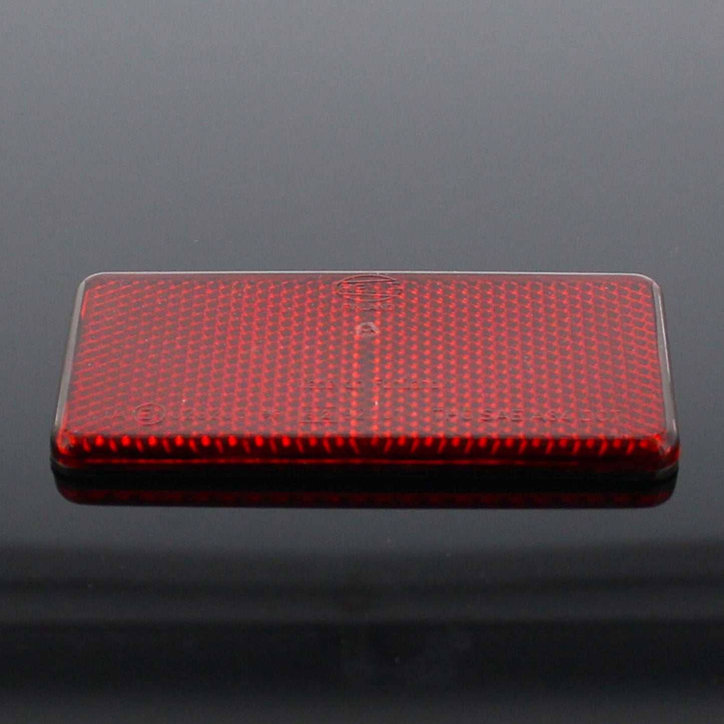 Hella Rückstrahler Rot Selbstklebend 94x44x6,5mm - TMN-shop.de